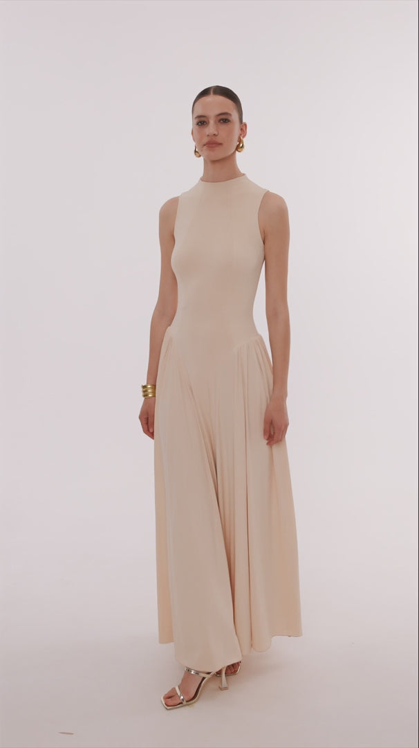 Sleeveless high-neck maxi dress with a pleated skirt